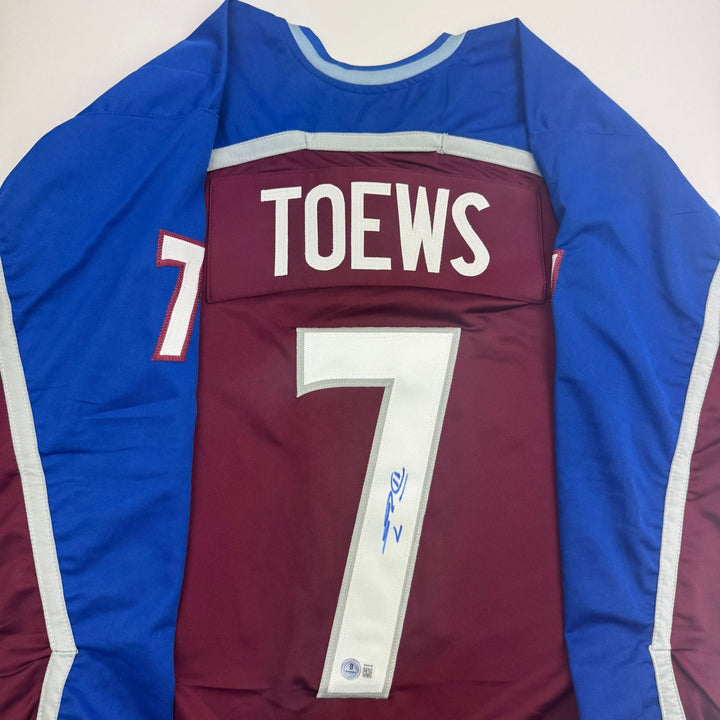 Autographed/Signed Devon Toews Colorado Maroon Jersey Beckett BAS COA