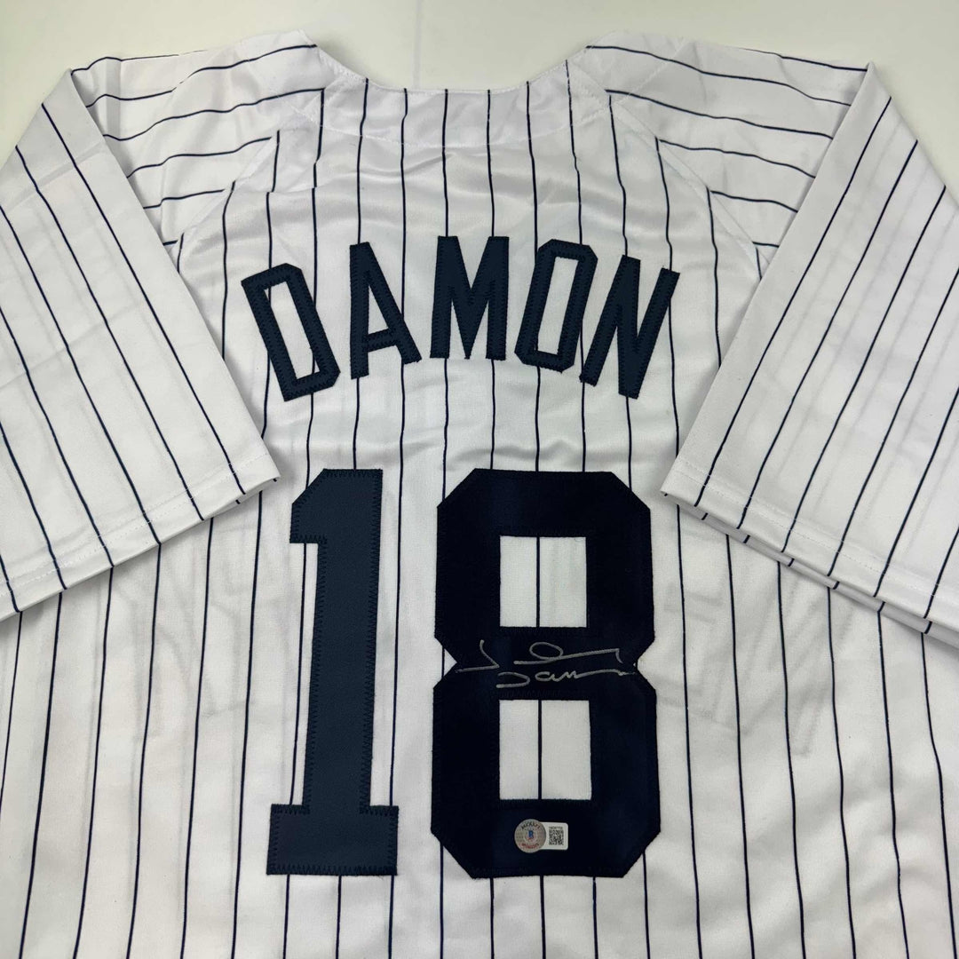 Autographed/Signed Johnny Damon New York Pinstripe Baseball Jersey Beckett COA