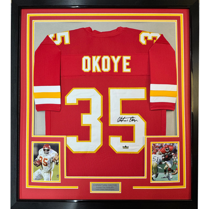 Framed Facsimile Autographed Christian Okoye 33x42 Red Reprint Laser Auto Jersey