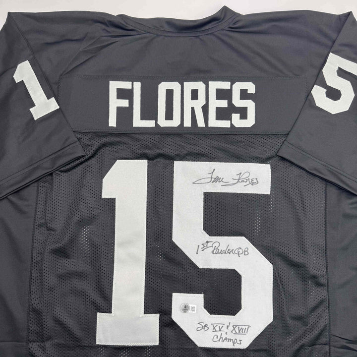 Autographed/Signed Tom Flores Las Vegas Oakland Black Jersey Beckett BAS COA