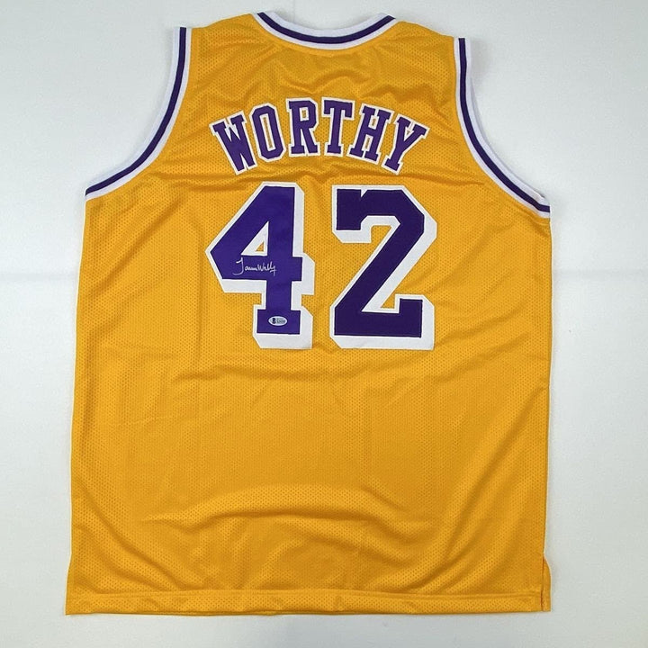 Autographed/Signed James Worthy Los Angeles LA Yellow Jersey Beckett COA