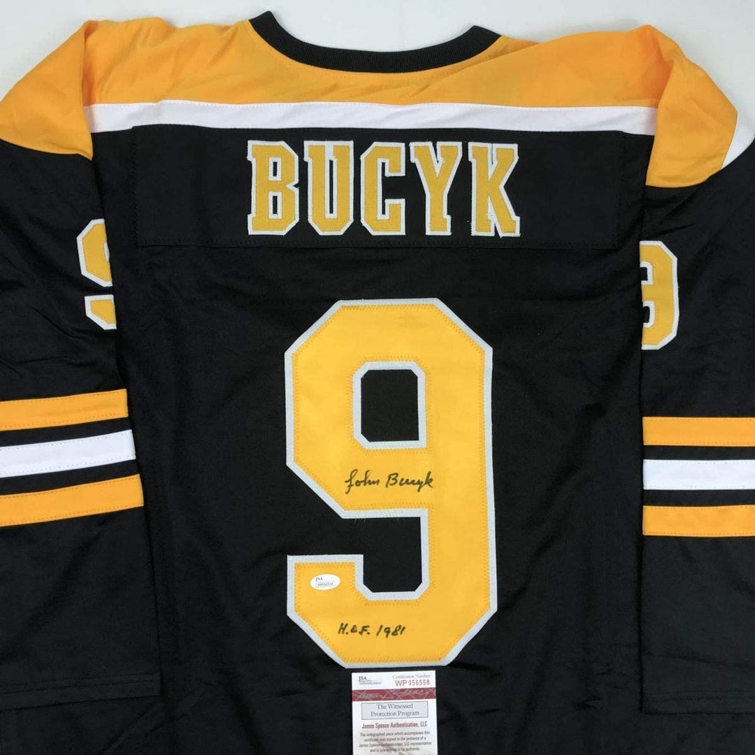 Autographed/Signed Johnny John Bucyk HOF 1981 Boston Black Jersey JSA COA