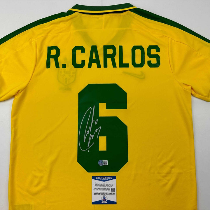 Autographed/Signed Roberto Carlos Brazil Yellow Retro Jersey Beckett COA