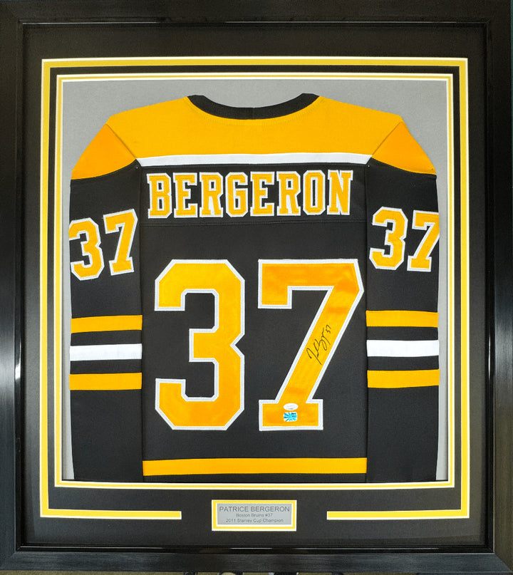 Framed Signed Patrice Bergeron 35x39 Boston Black Jersey PSA COA