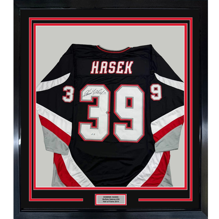 Framed Autographed/Signed Dominik Hasek 35x39 Buffalo Black Jersey BAS COA