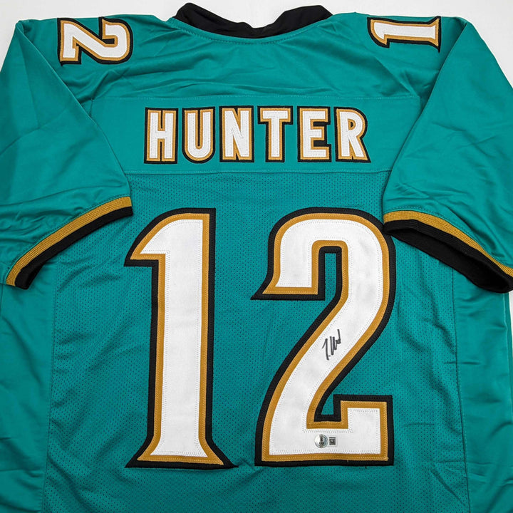 Autographed/Signed Travis Hunter Jacksonville Teal Retro Jersey Beckett BAS COA