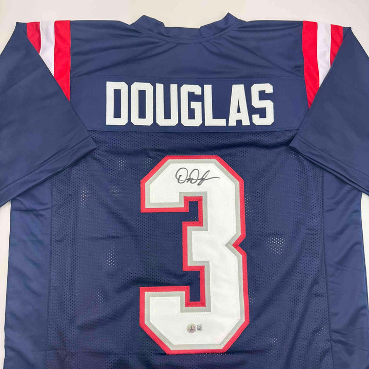 Autographed/Signed DeMario Douglas New England Blue Jersey Beckett BAS COA