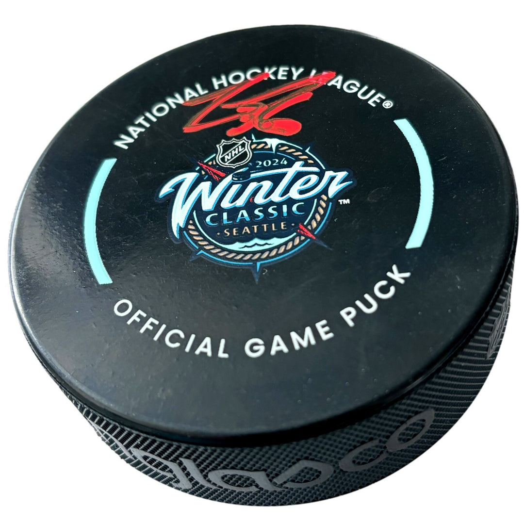 Logan Thompson Autographed 2024 Winter Classic Puck Vegas Golden Knights Signed