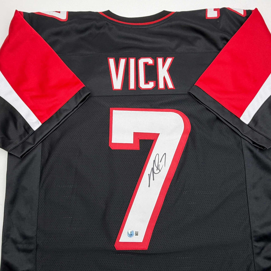 Autographed/Signed MICHAEL MIKE VICK Atlanta Black Jersey PSA/DNA COA