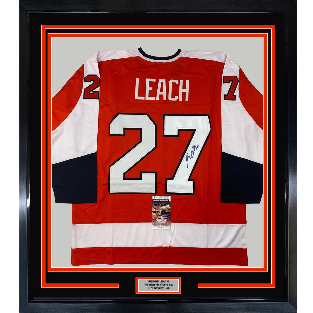 Framed Autographed/Signed Reggie Leach 33x42 Philadelphia Orange Jersey JSA COA