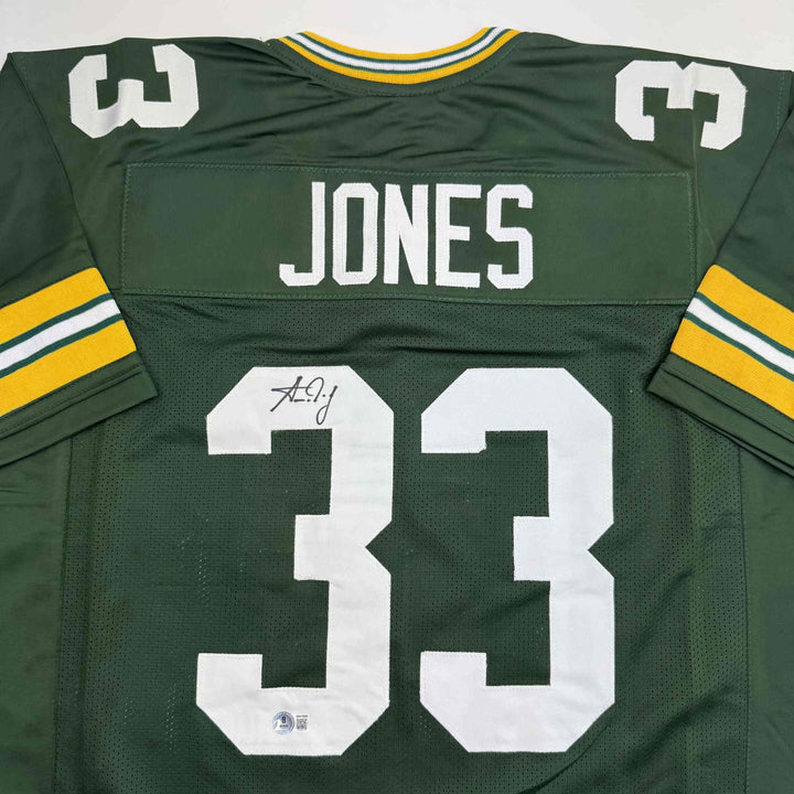Autographed/Signed Aaron Jones Green Bay Green Football Jersey Beckett BAS COA