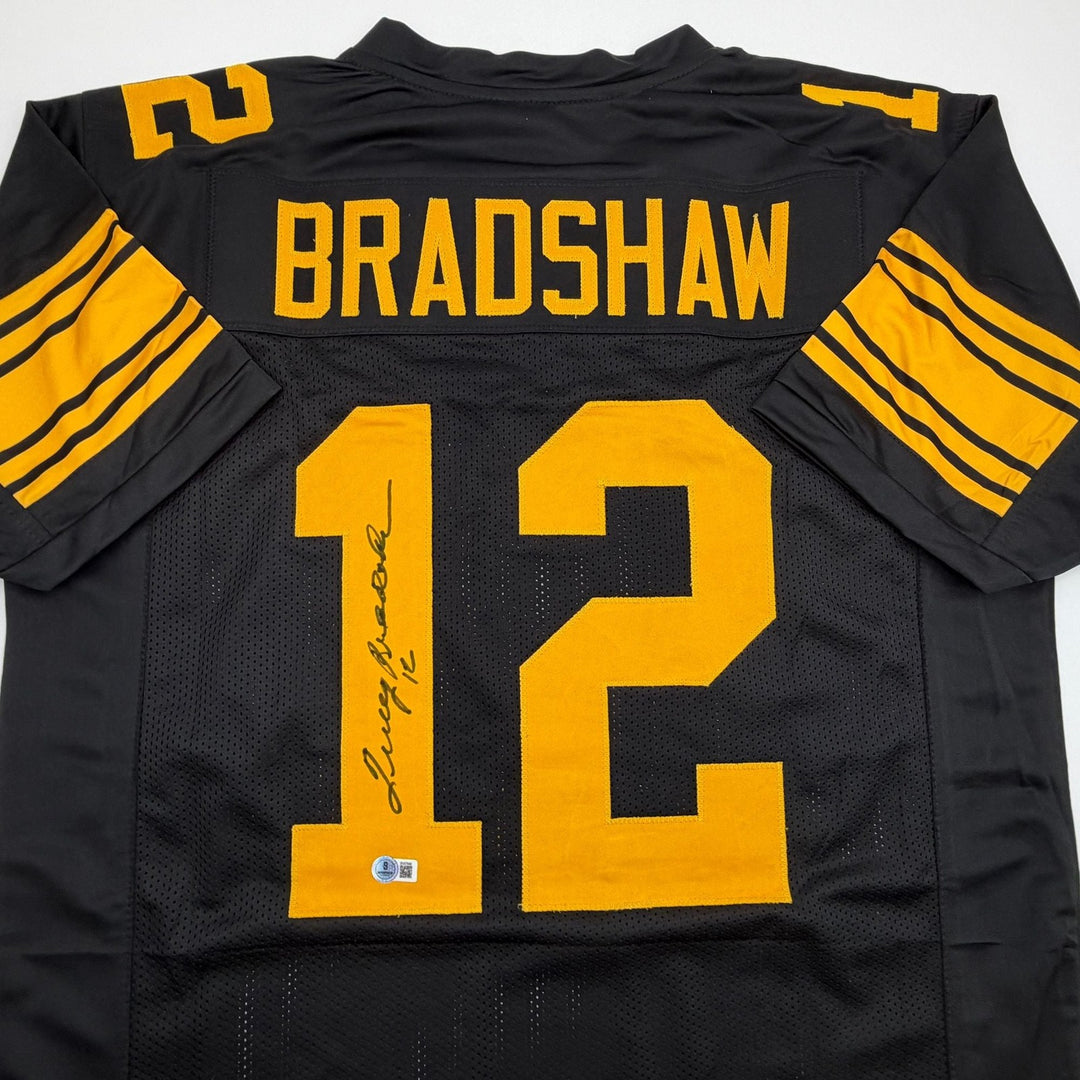 Autographed/Signed Terry Bradshaw Pittsburgh Black Color Rush Jersey Beckett COA