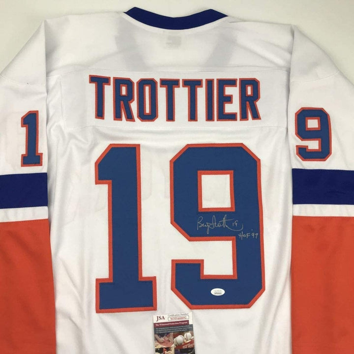 Autographed/Signed Bryan Trottier HOF 97 New York White Jersey JSA COA