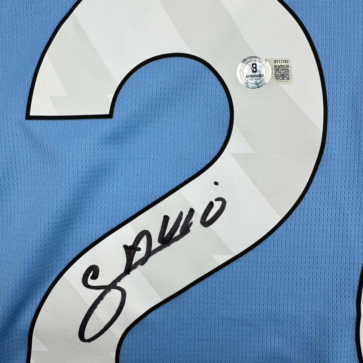 Autographed/Signed Savinho Manchester City Blue Soccer Jersey Beckett BAS COA