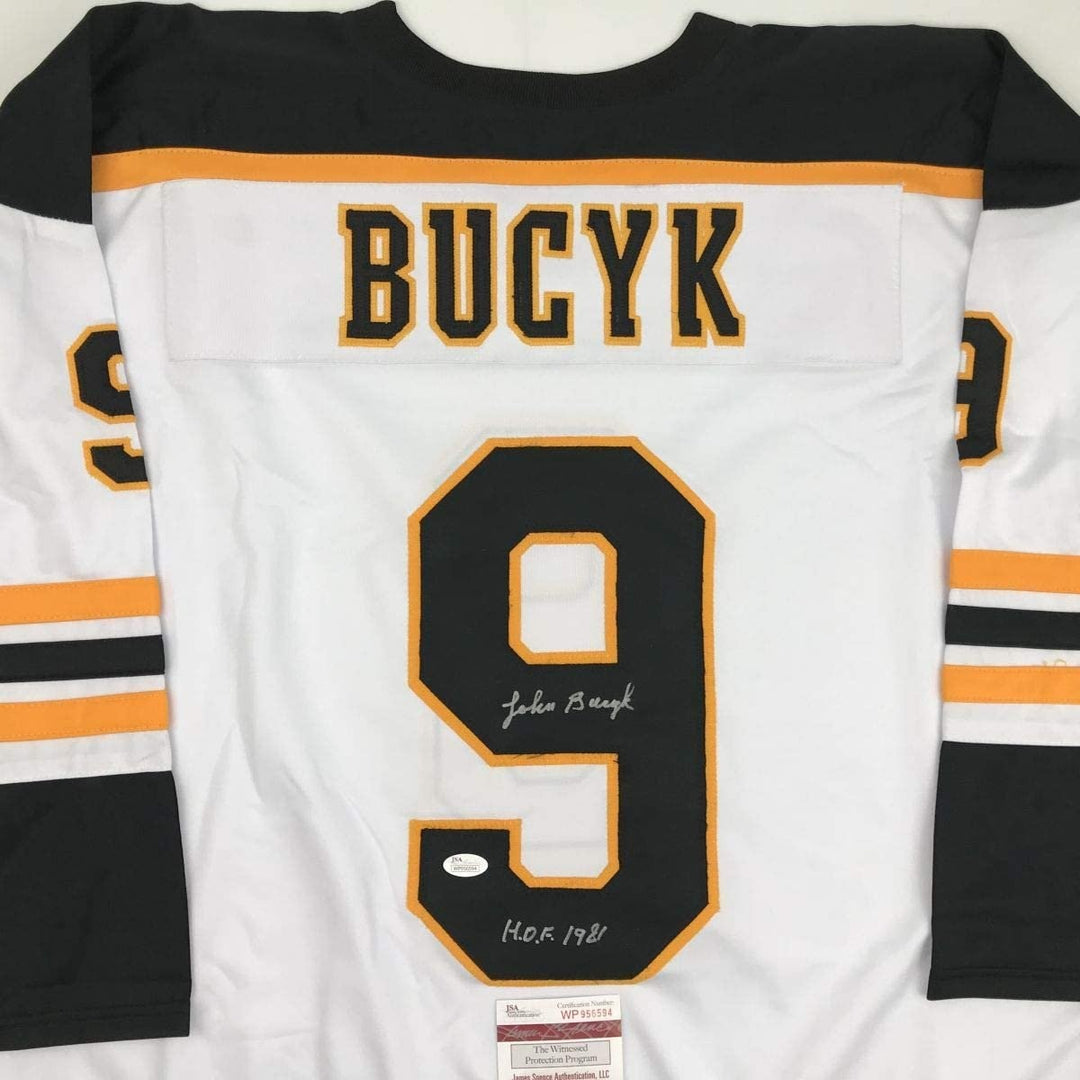 Autographed/Signed Johnny John Bucyk HOF 1981 Boston White Jersey JSA COA