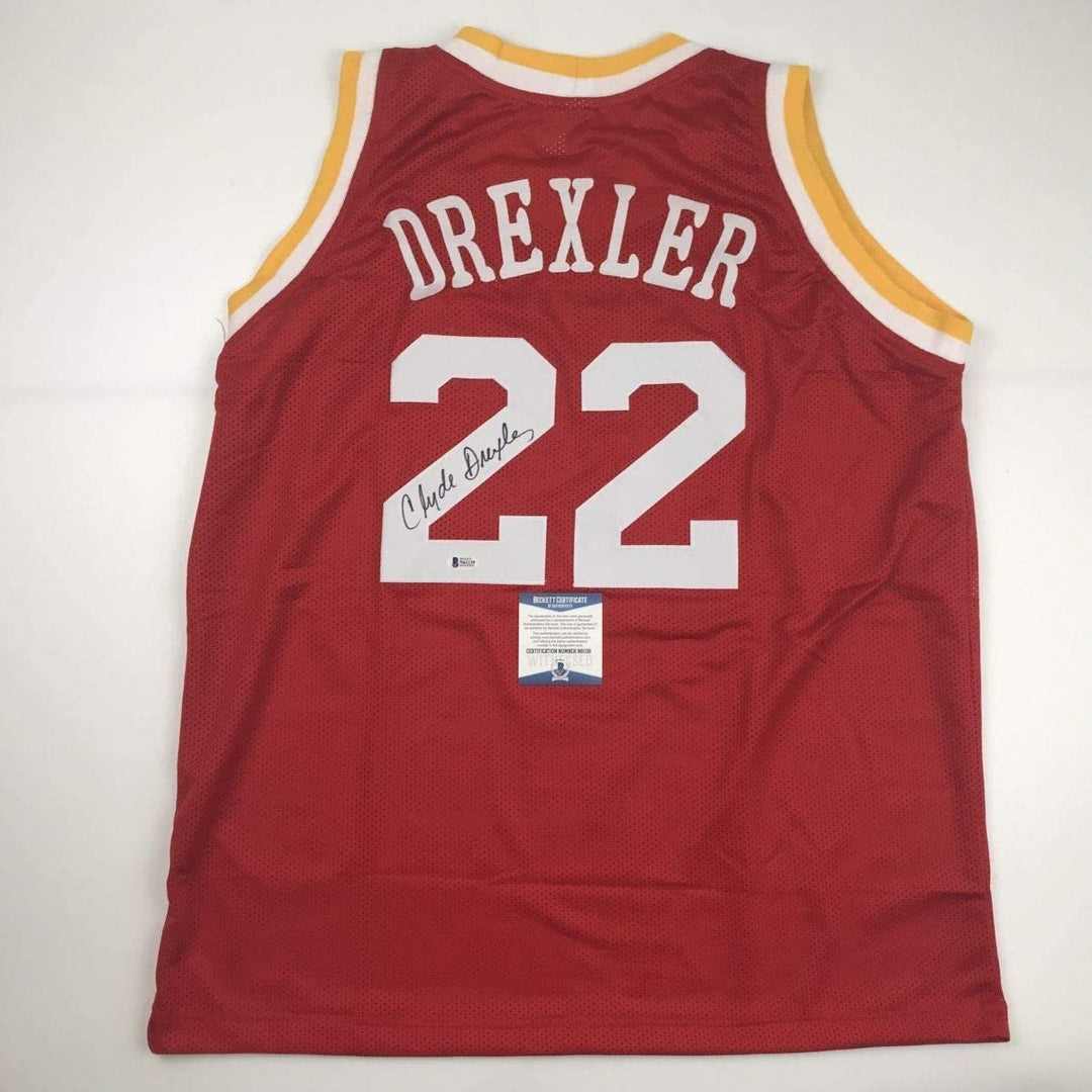 Autographed/Signed Clyde Drexler Houston Red Jersey Beckett BAS COA