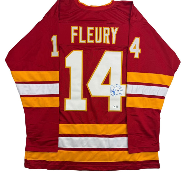 Autographed/Signed Theo Fleury Calgary Red Hockey Jersey Beckett BAS COA