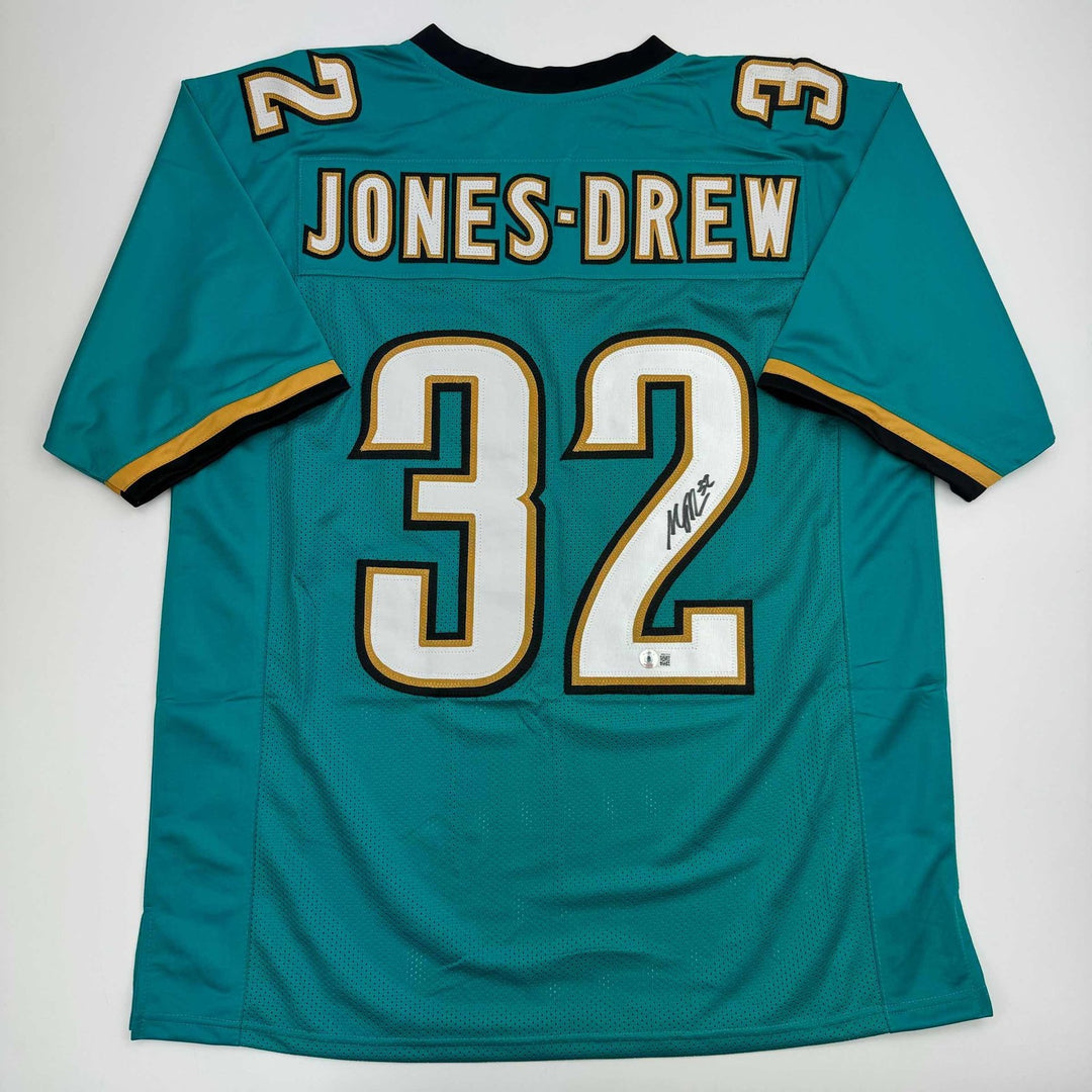 Autographed/Signed Maurice Jones-Drew Jacksonville Teal Jersey BAS COA