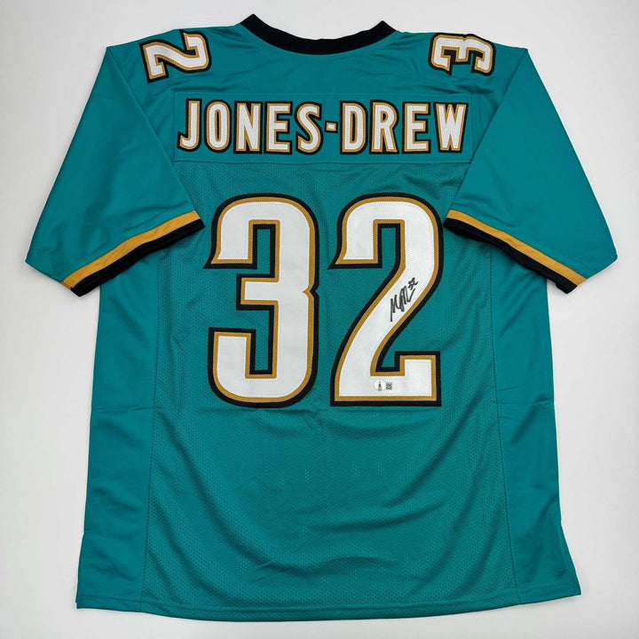 Autographed/Signed Maurice Jones-Drew Jacksonville Teal Jersey BAS COA
