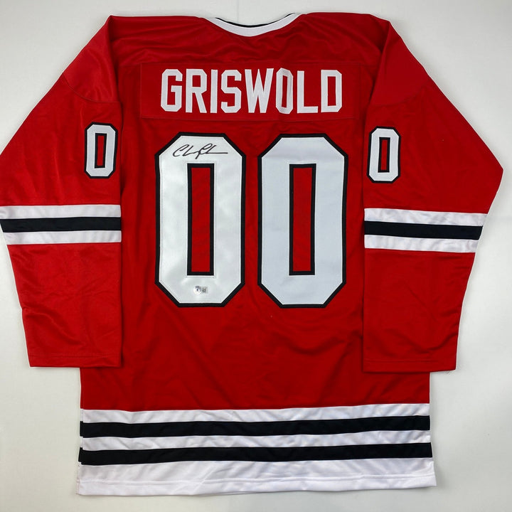 Autographed/Signed Chevy Chase Clark Griswold Vacation Red Jersey BAS COA