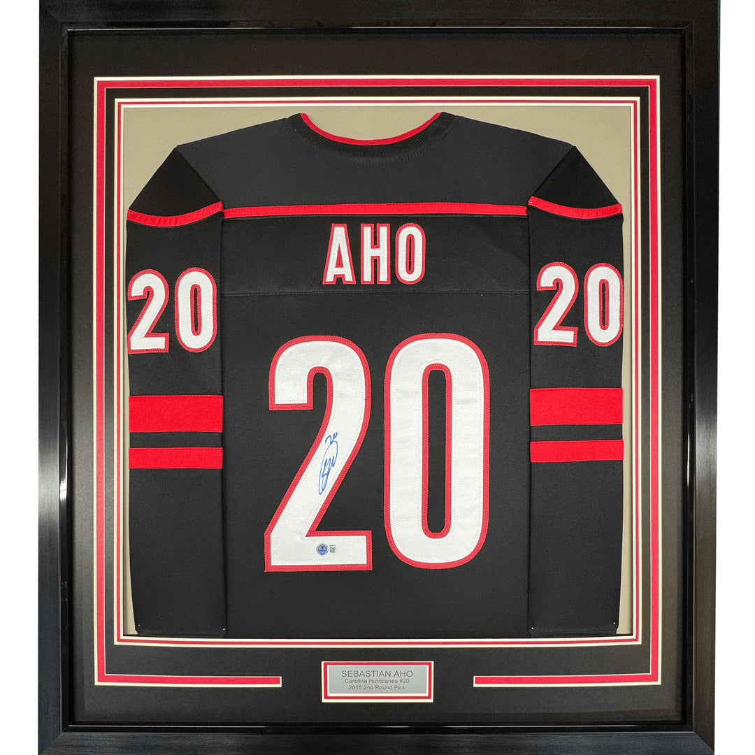 Framed Autographed/Signed Sebastian Aho 35x39 Carolina Black Jersey JSA COA