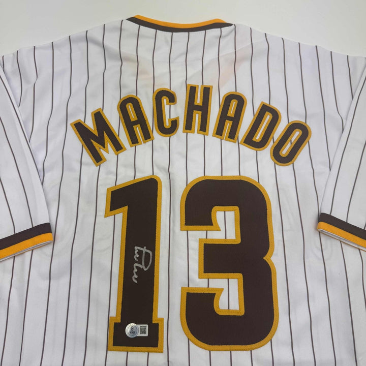 Autographed/Signed MANNY MACHADO San Diego Pinstripe Jersey Beckett COA