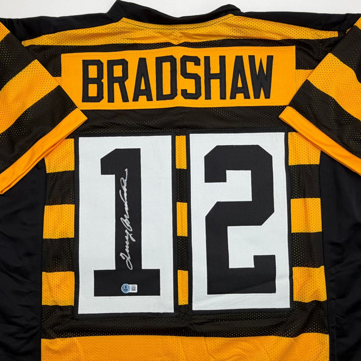 Autographed/Signed Terry Bradshaw Pittsburgh Bumble Bee Jersey Beckett COA