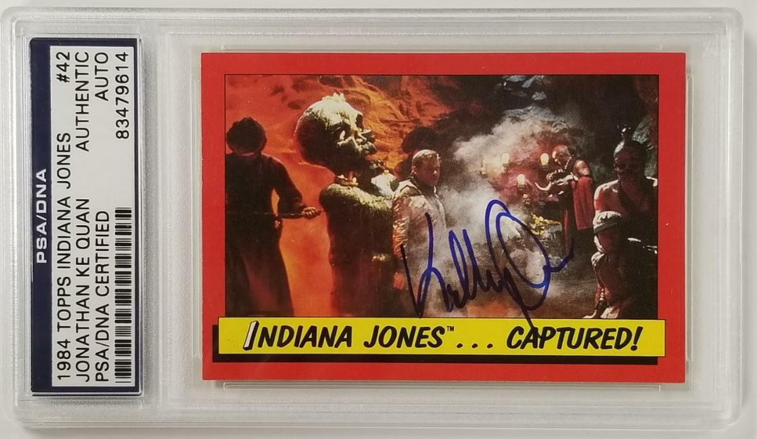 Jonathan Ke Quan signed 1984 Topps Indiana Jones #42 Indiana Captured Card ~ PSA