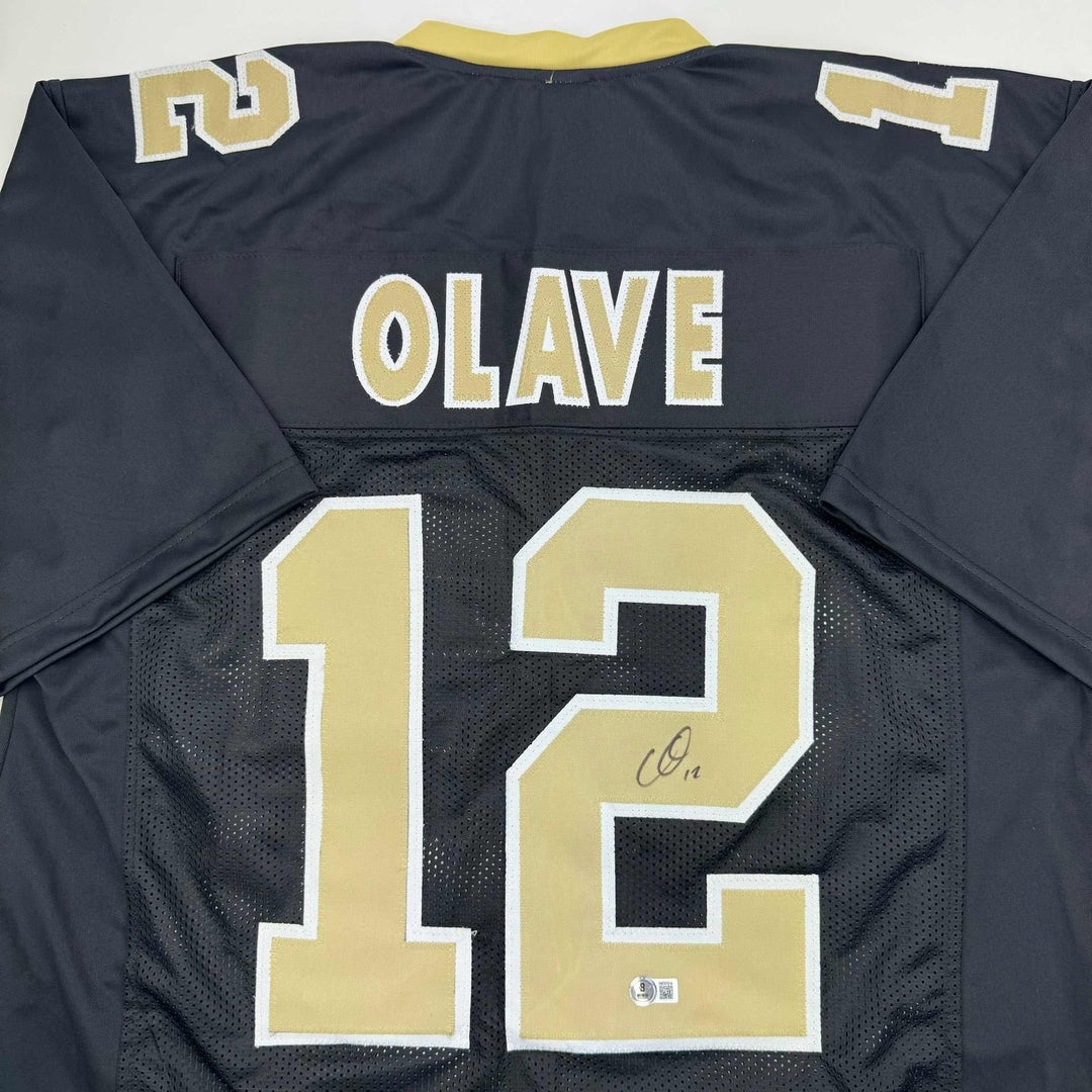 Autographed/Signed Chris Olave New Orleans Black Jersey Beckett BAS COA