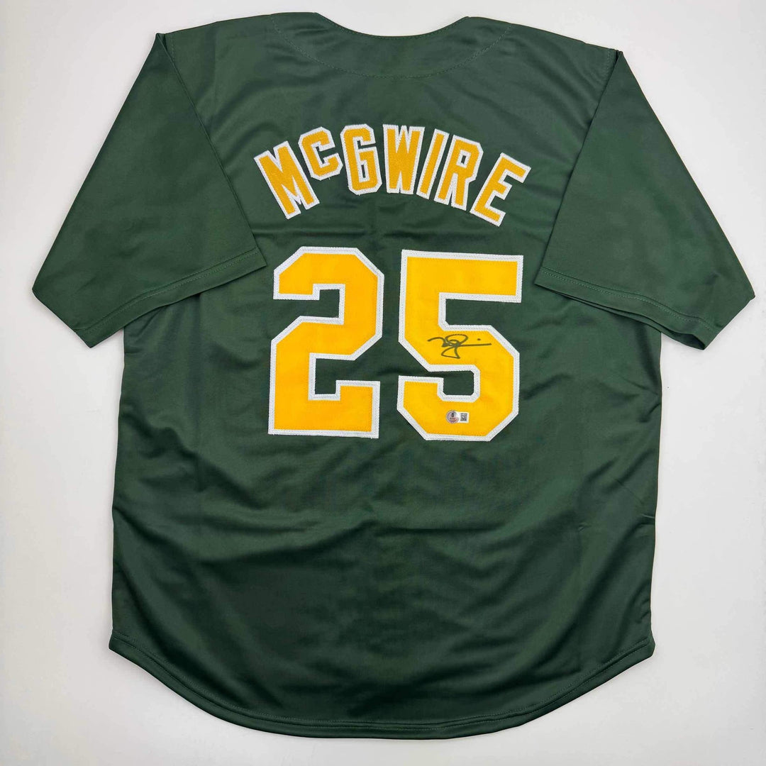 Autographed/Signed Mark McGwire Oakland Green Baseball Jersey Beckett BAS COA