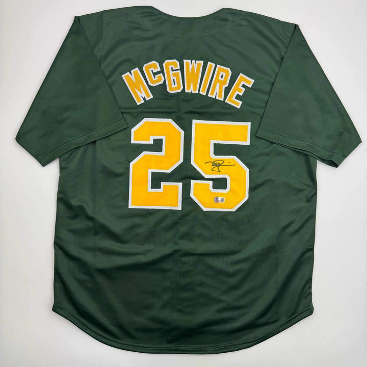 Autographed/Signed Mark McGwire Oakland Green Baseball Jersey Beckett BAS COA