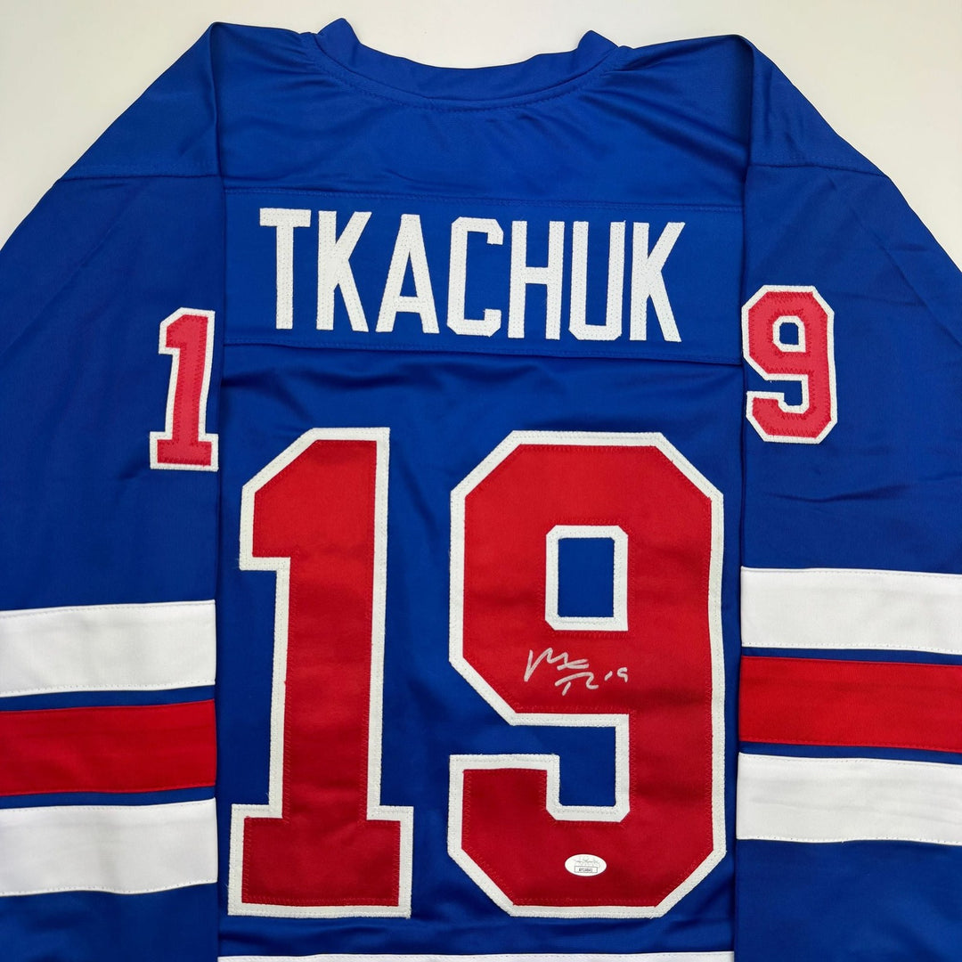 Autographed/Signed Matthew Tkachuk USA 2026 Olympics Blue Hockey Jersey JSA COA