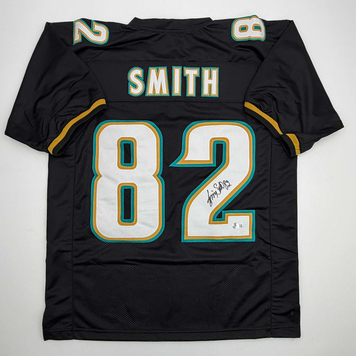 Autographed/Signed Jimmy Smith Jacksonville Black Football Jersey Beckett COA