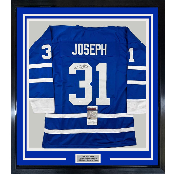 Framed Autographed/Signed Curtis Joseph 35x39 Toronto Blue Jersey JSA COA