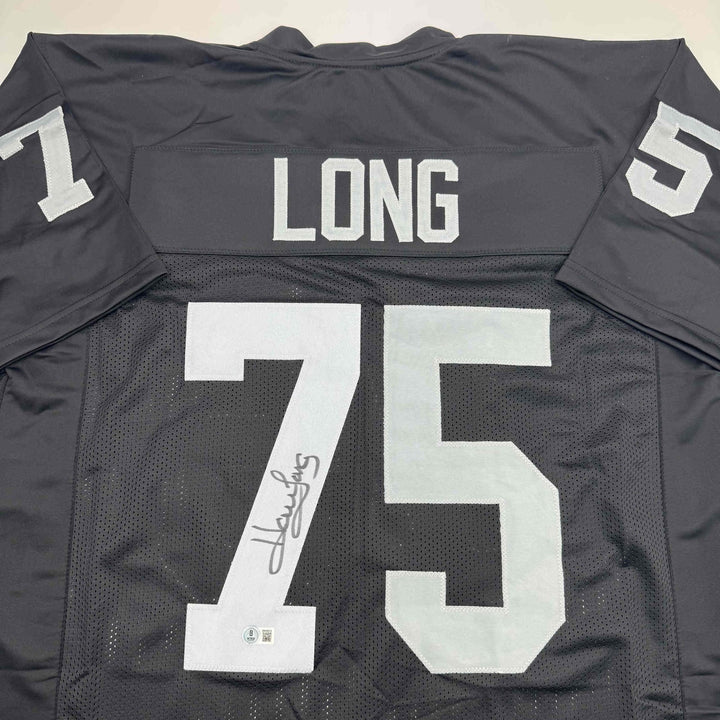 Autographed/Signed Howie Long Oakland White Football Jersey Beckett BAS COA