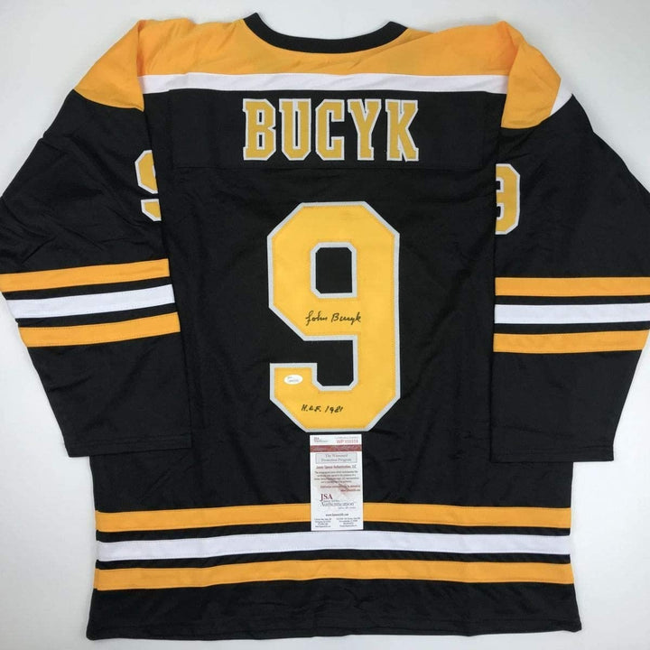 Autographed/Signed Johnny John Bucyk HOF 1981 Boston Black Jersey JSA COA