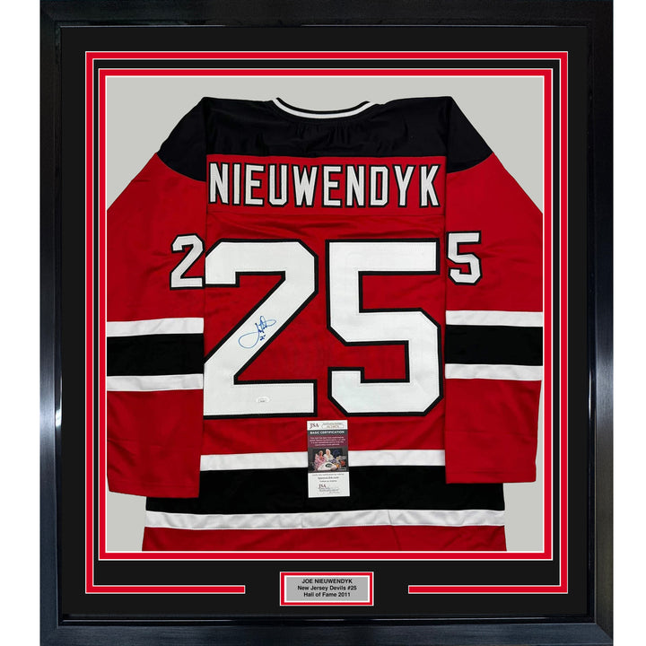 Framed Autographed/Signed Joe Nieuwendyk 35x39 New Jersey Red Jersey JSA COA