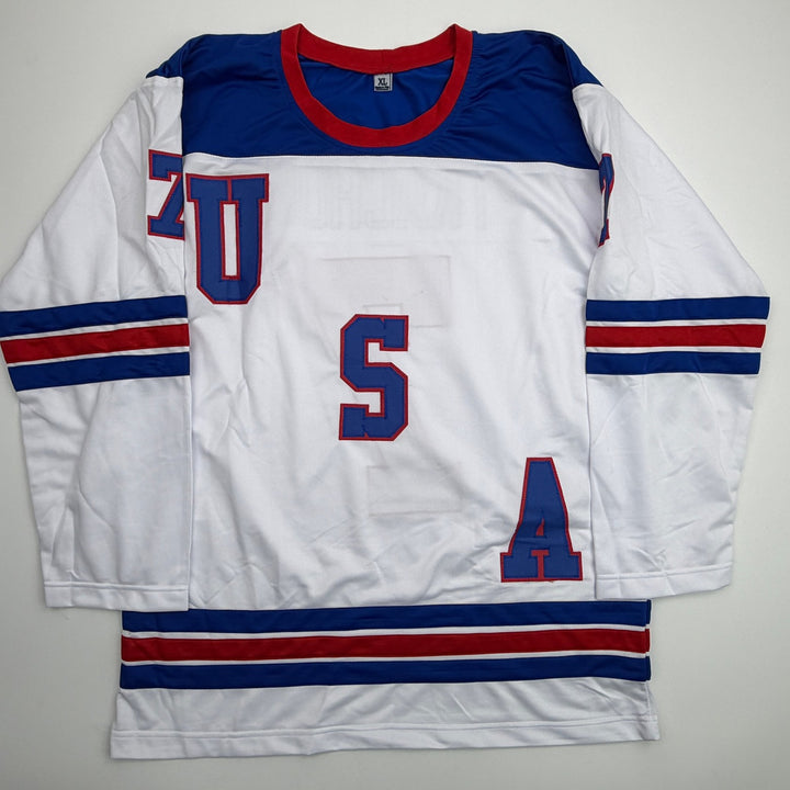 Autographed/Signed Brady Tkachuk USA 2026 Olympics Gold White Jersey JSA COA