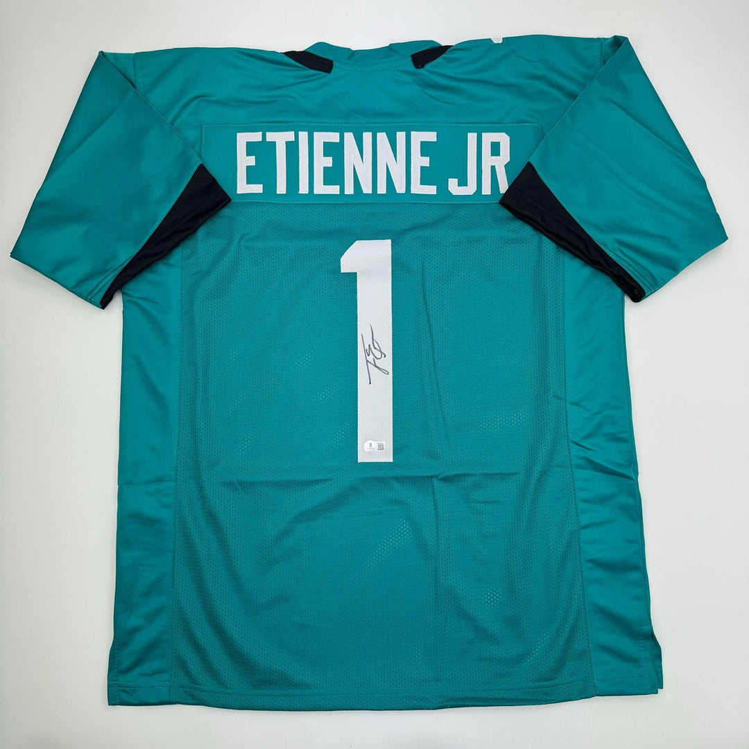 Autographed/Signed Travis Etienne Jr. Jacksonville Teal Jersey Beckett COA