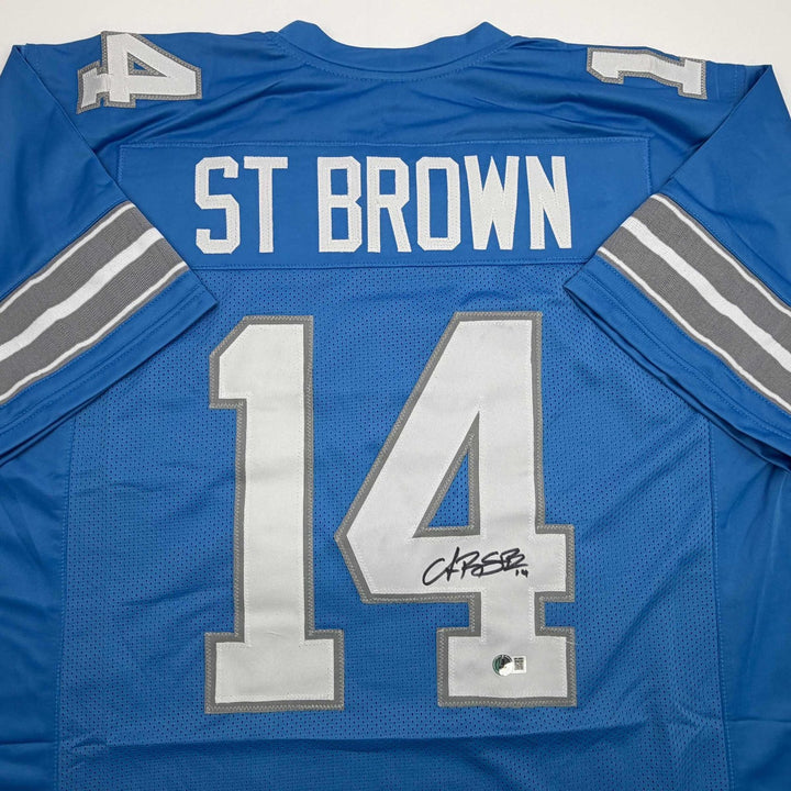 Autographed/Signed Amon-Ra St. Brown Detroit Current Blue Jersey BAS COA