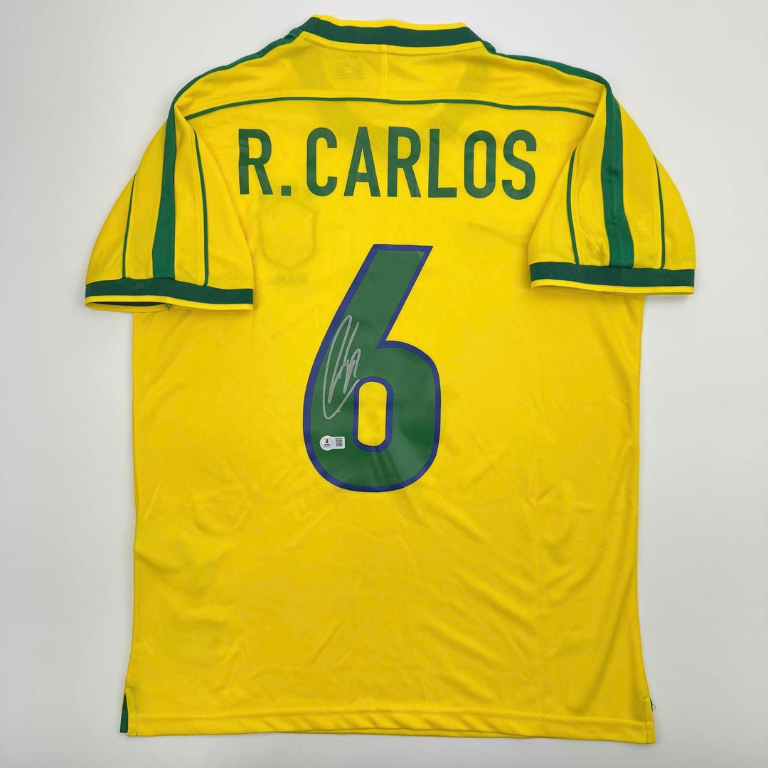 Autographed/Signed Roberto Carlos Brazil Yellow Jersey Beckett BAS COA