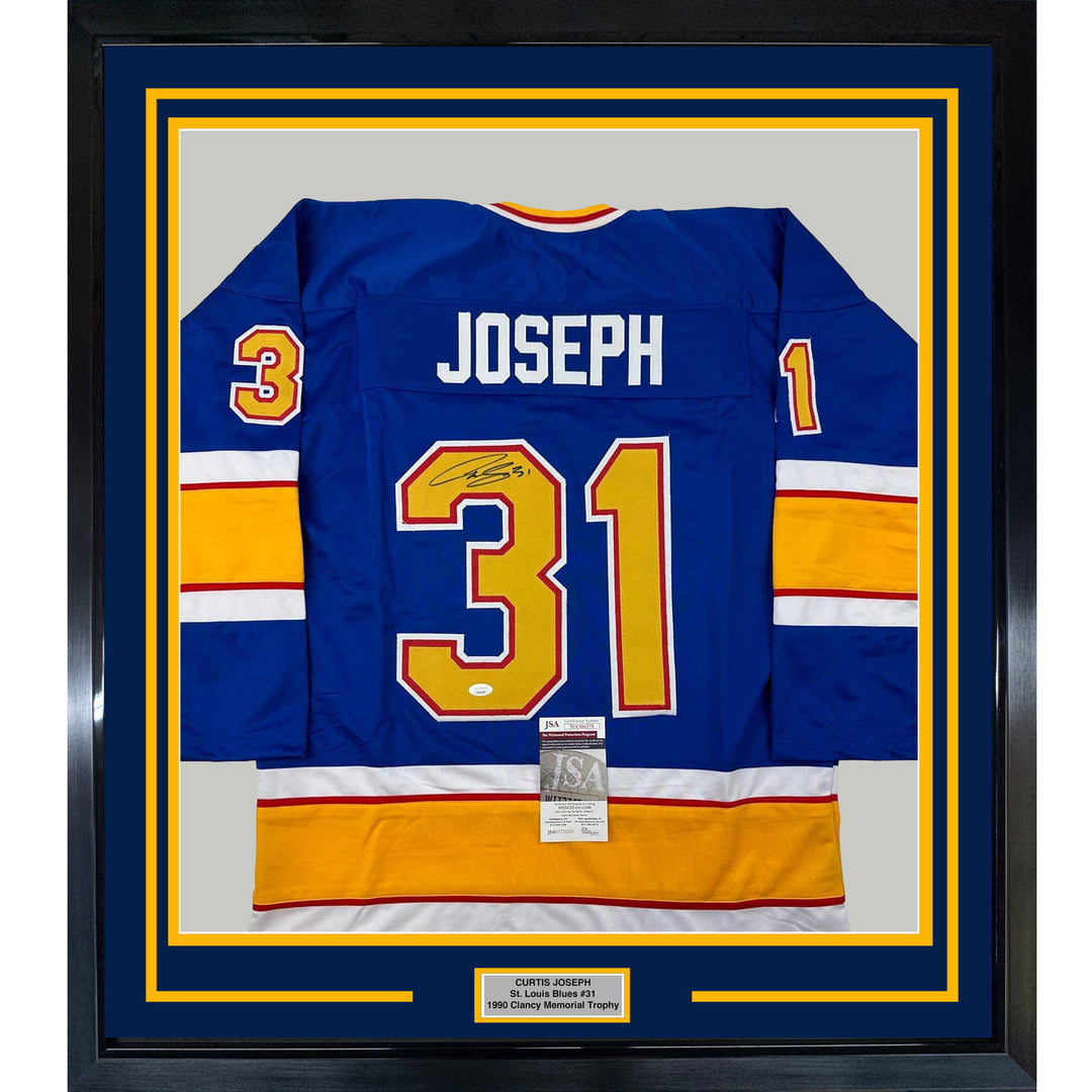 Framed Autographed/Signed Curtis Joseph 33x42 St. Louis Blue Jersey JSA COA