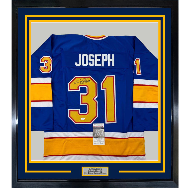 Framed Autographed/Signed Curtis Joseph 33x42 St. Louis Blue Jersey JSA COA