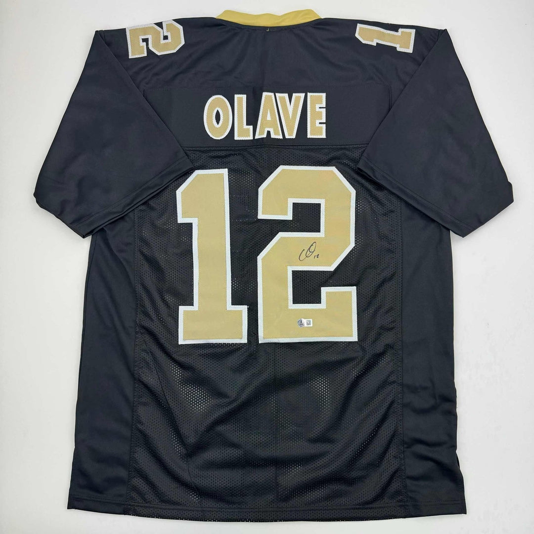 Autographed/Signed Chris Olave New Orleans Black Jersey Beckett BAS COA