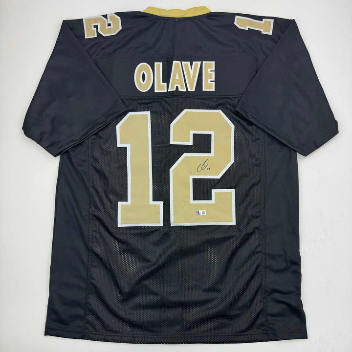 Autographed/Signed Chris Olave New Orleans Black Jersey Beckett BAS COA