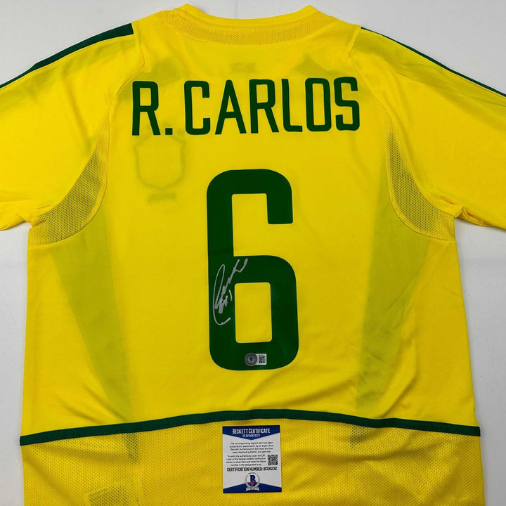 Autographed/Signed Roberto Carlos Brazil Yellow Jersey Beckett BAS COA