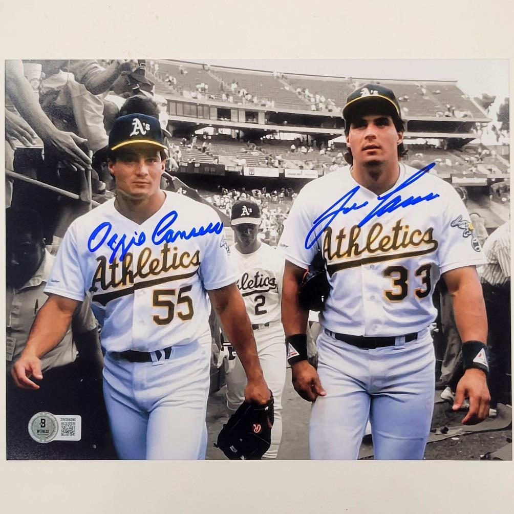 Jose Canseco & Ozzie Canseco signed Oakland A's 8x10 photo autograph Beckett BAS