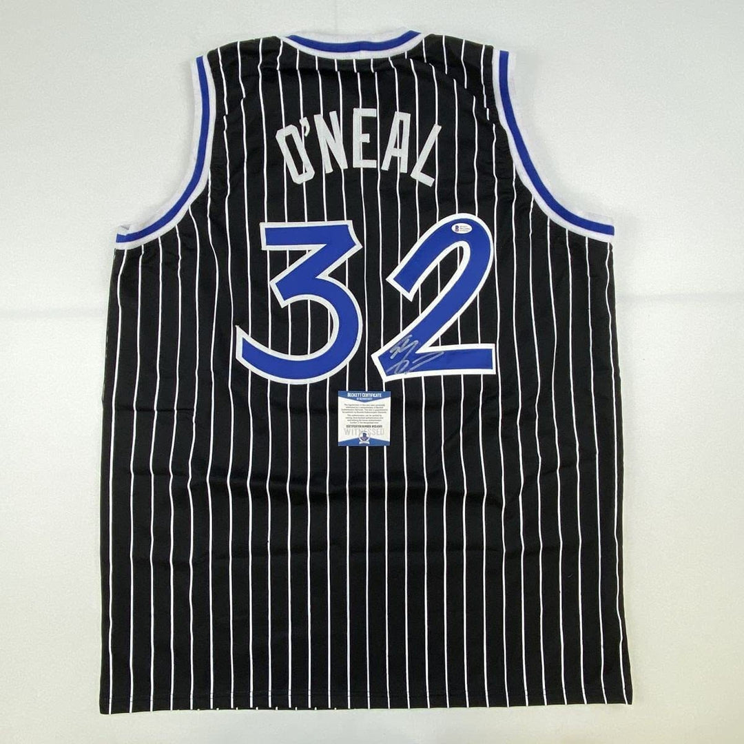 Autographed/Signed SHAQUILLE SHAQ O'NEAL Orlando Black Pinstripe Jersey BAS COA