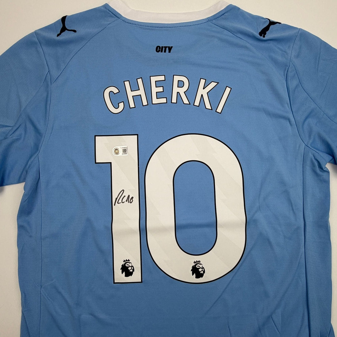 Autographed/Signed Rayan Cherki Manchester City Blue Jersey Beckett BAS COA