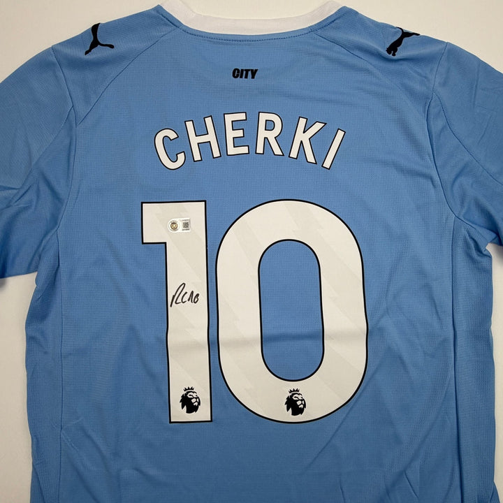 Autographed/Signed Rayan Cherki Manchester City Blue Jersey Beckett BAS COA